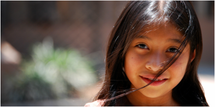 A young girl smiling